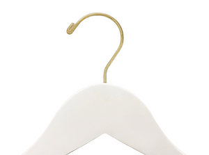 Top of Ivory Off White Wooden Flat Suit Hanger with a gold hook for residential homes and retail spaces