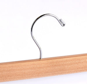 Top of high quality Natural Wooden Bottom Hanger for adults with a silver hook facing to the right