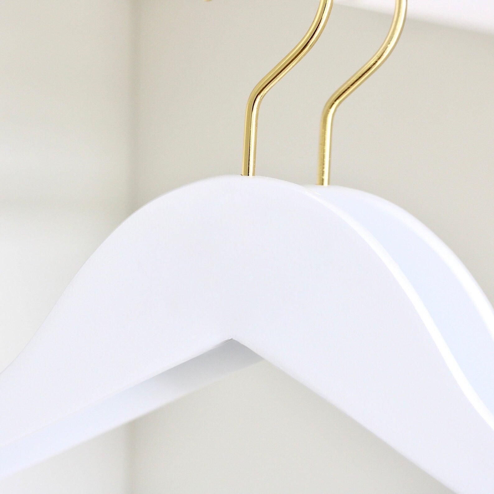 Two wedding quality White Wooden Suit Hangers with gold hooks for custom hanger designers