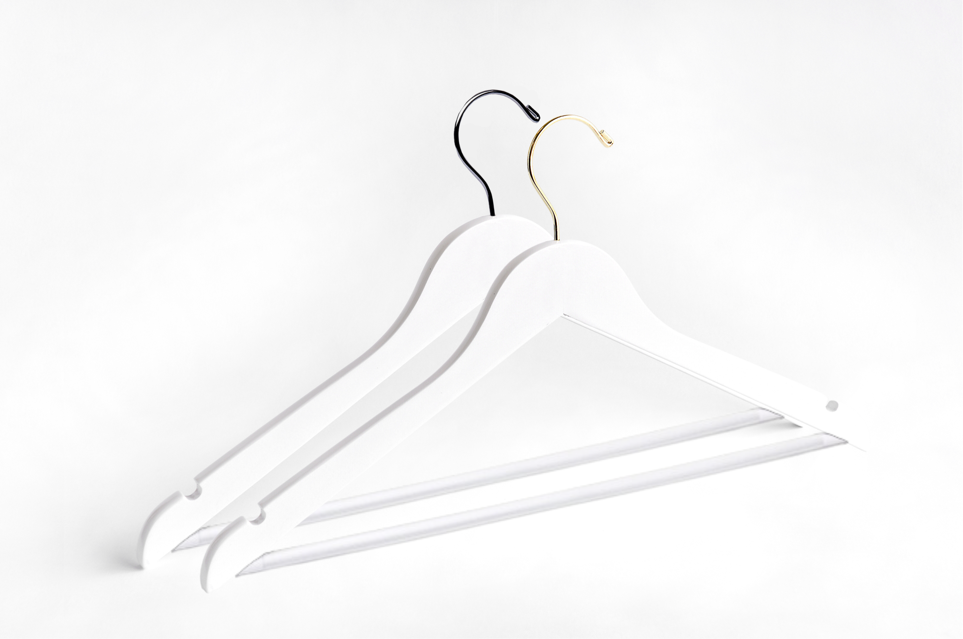 Two White Wooden Adult Flat Suit Hangers with a silver hook and a gold hook for residential closets and retail stores