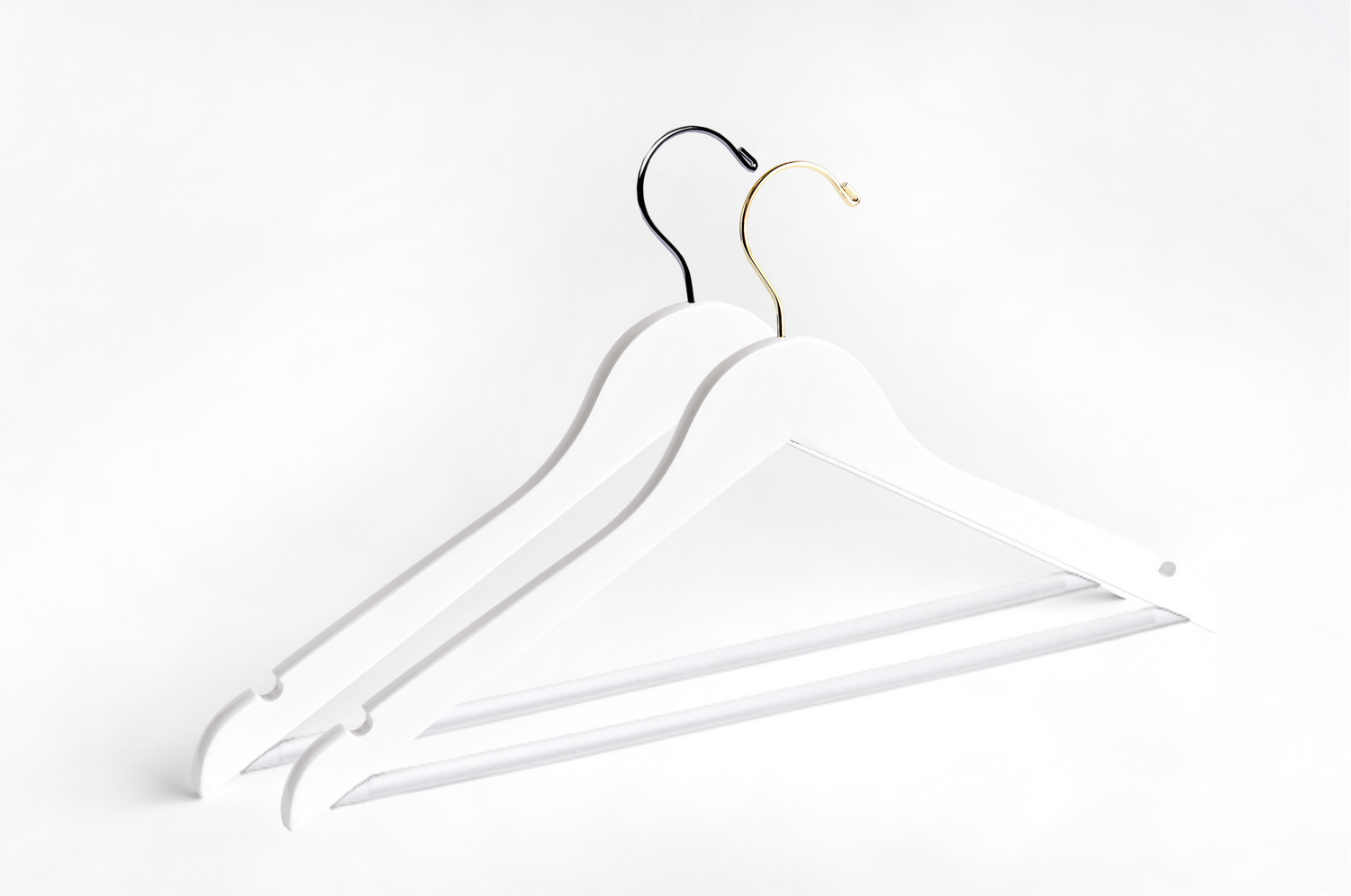 Two White Wooden Adult Flat Suit Hangers with a silver hook and a gold hook for residential closets and retail stores