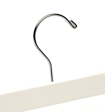 Top of a high quality Ivory Off-White Wooden Bottom Hanger for adults with a silver hook facing to the right 