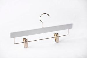 White Wooden Bottom Hanger with a gold hook and adjustable cushion clips for residential closets and retail stores #hardware-color_gold