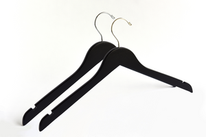 Two Matte Black Wooden Adult Clothes Hangers with a gold hook and a silver hook for residential closets and retail stores #hook-color_gold-hook