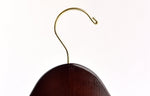 Load image into Gallery viewer, Top of Dark Walnut Wooden Clothes Hanger with a gold hook facing to the right #hook-color_gold-hook
