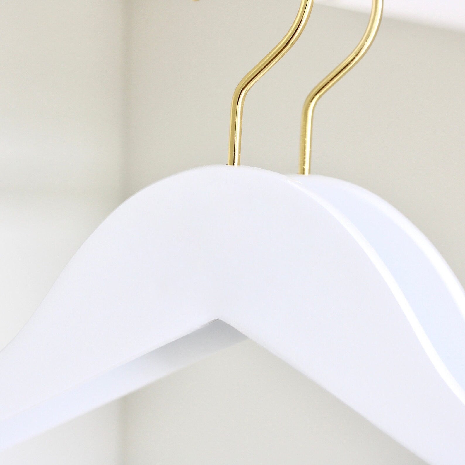 Two wedding quality White Wooden Hangers with gold hooks for custom hanger designers #hook-color_gold-hook