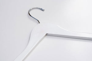 A White Wooden Clothes Hanger lying down with a silver hook for luxury closets and stores #hook-color_silver-hook