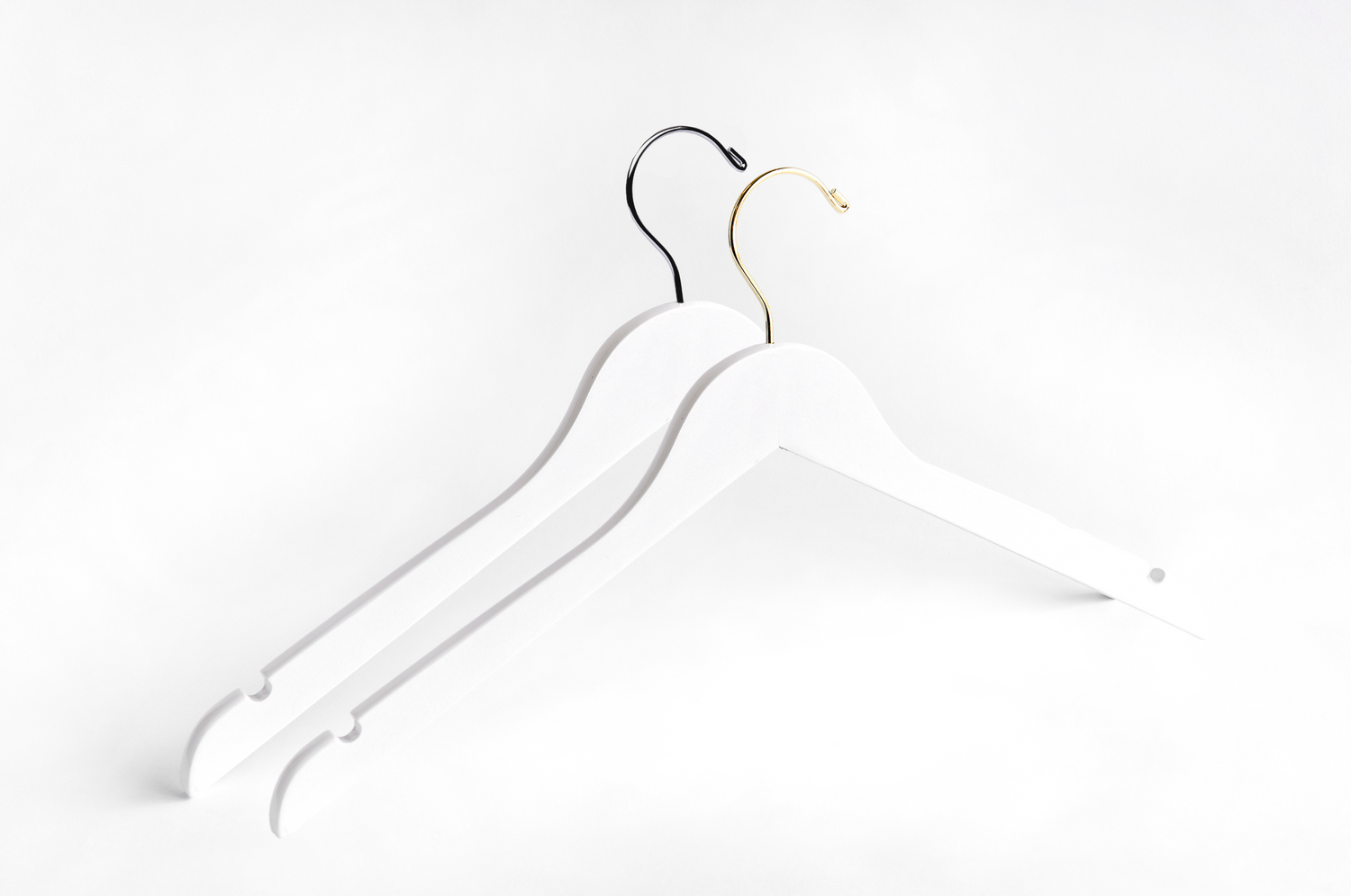 Two White Wooden Adult Clothes Hangers with a silver hook and a gold hook for residential closets and retail stores 