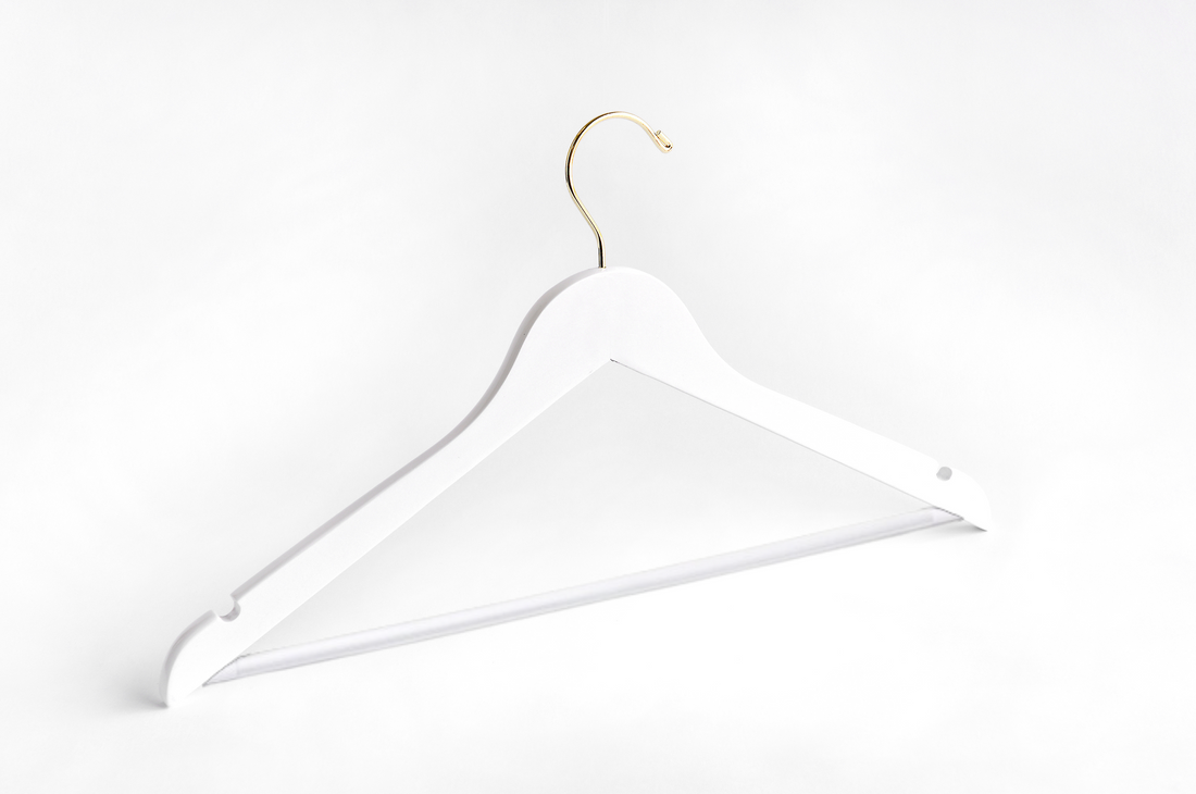 White Wooden Suit Hanger with a gold hook, shoulder notches, and non-slip pant bar for custom bridal hanger designers