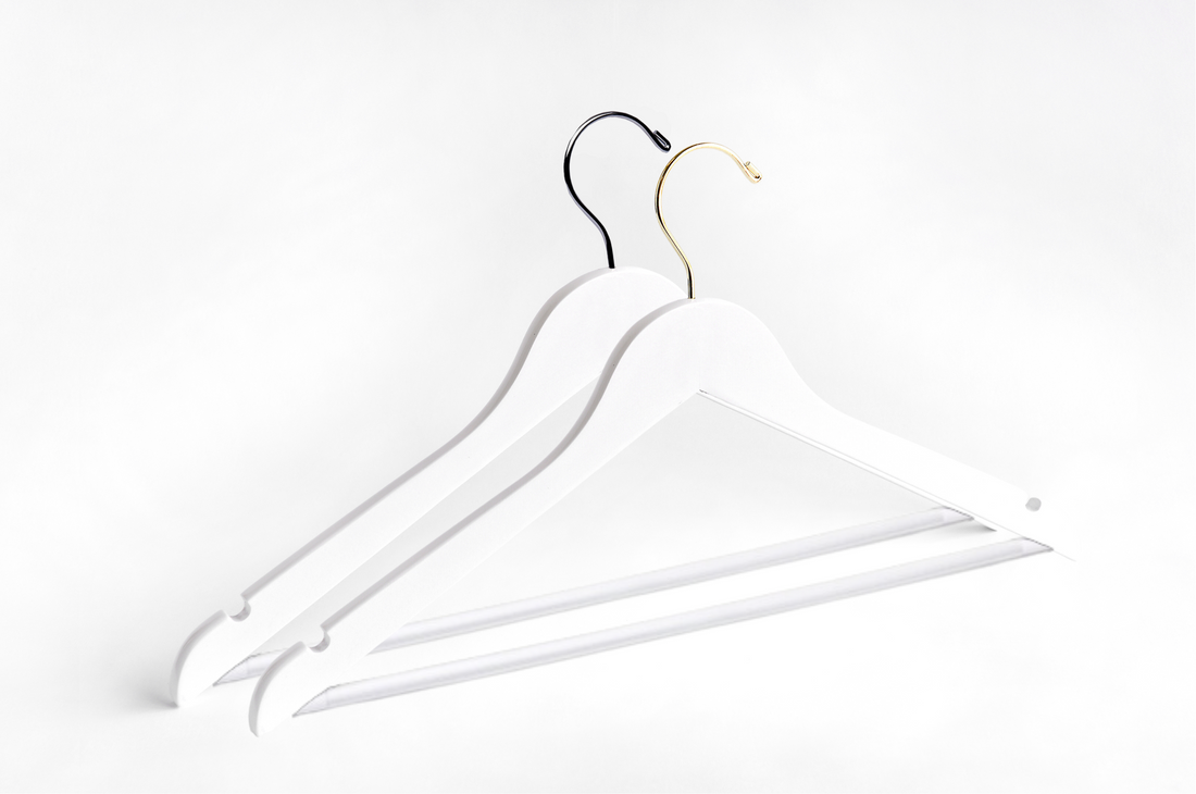 Two White Wooden Adult Flat Suit Hangers with a silver hook and a gold hook for residential closets and retail stores