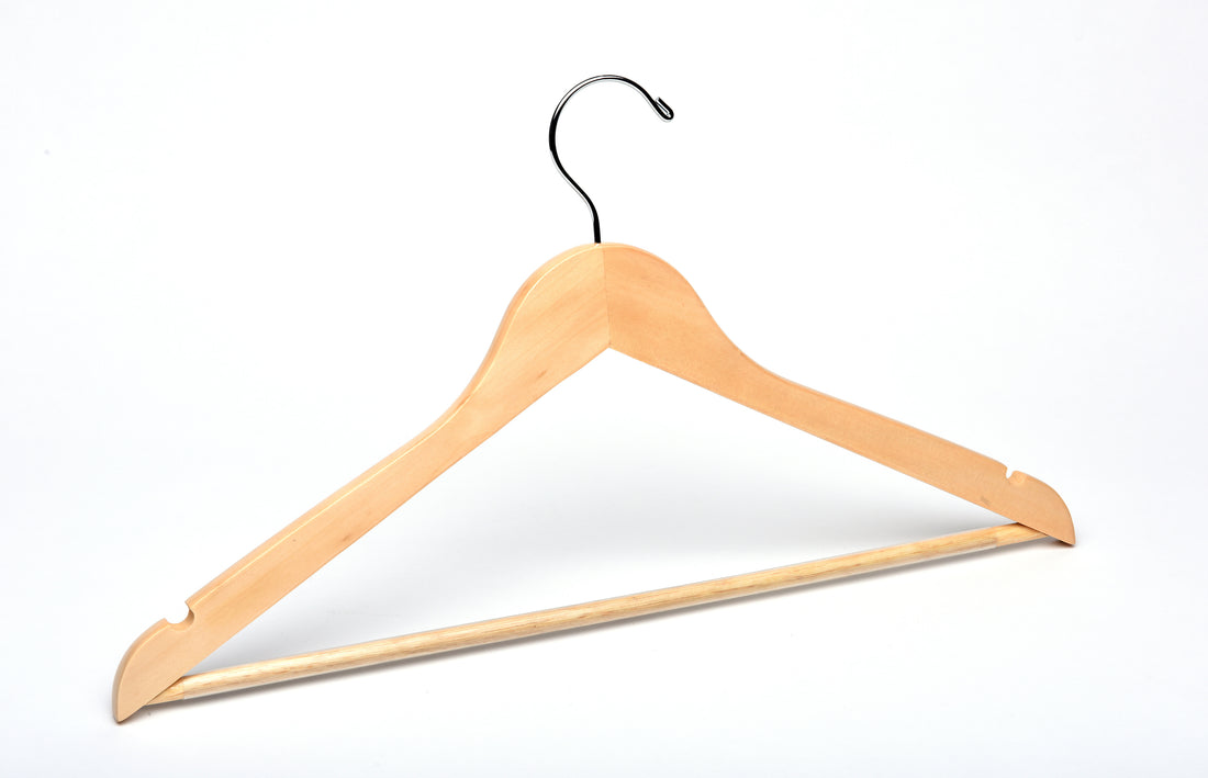 Natural Wood Flat Suit Hanger with a silver hook, shoulder notches, and pant bar for residential closets and retail stores