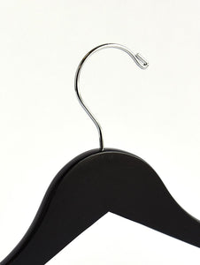 Top of a high quality Matte Black Wooden Combination Hanger for adults with a silver hook facing to the left