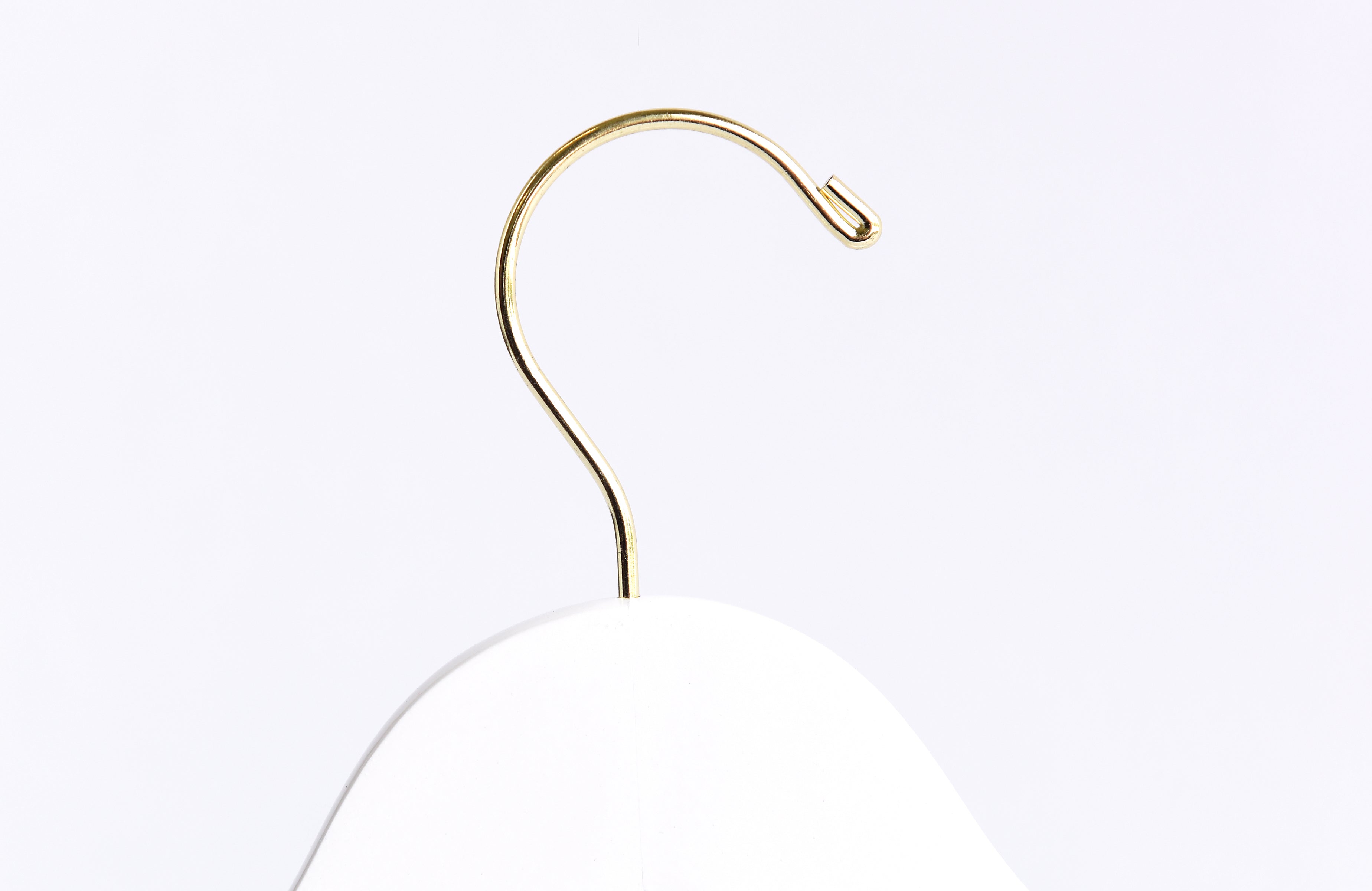 Top of Stark White Wooden Clothes Hanger with a gold hook for residential homes and retail spaces #hook-color_gold-hook